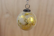 Antica sfera in lamina dorata